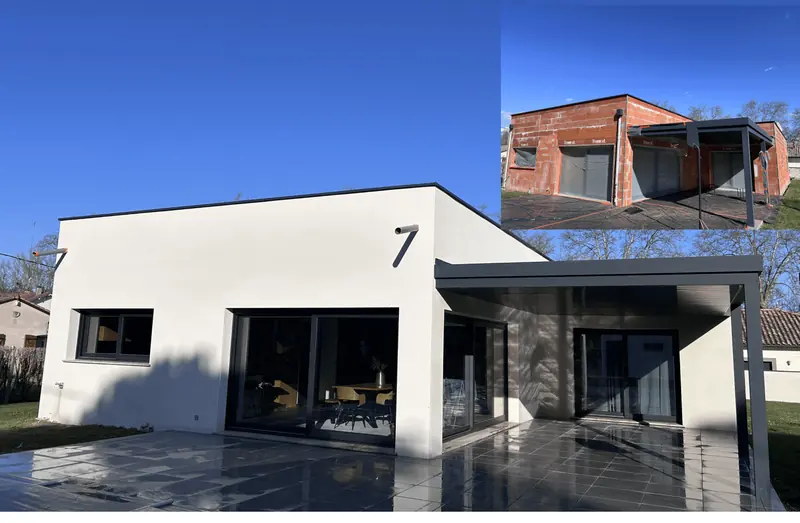 Façade blanche rénovée d'une maison individuelle